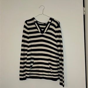 Navy blue and white striped hooded sweater.